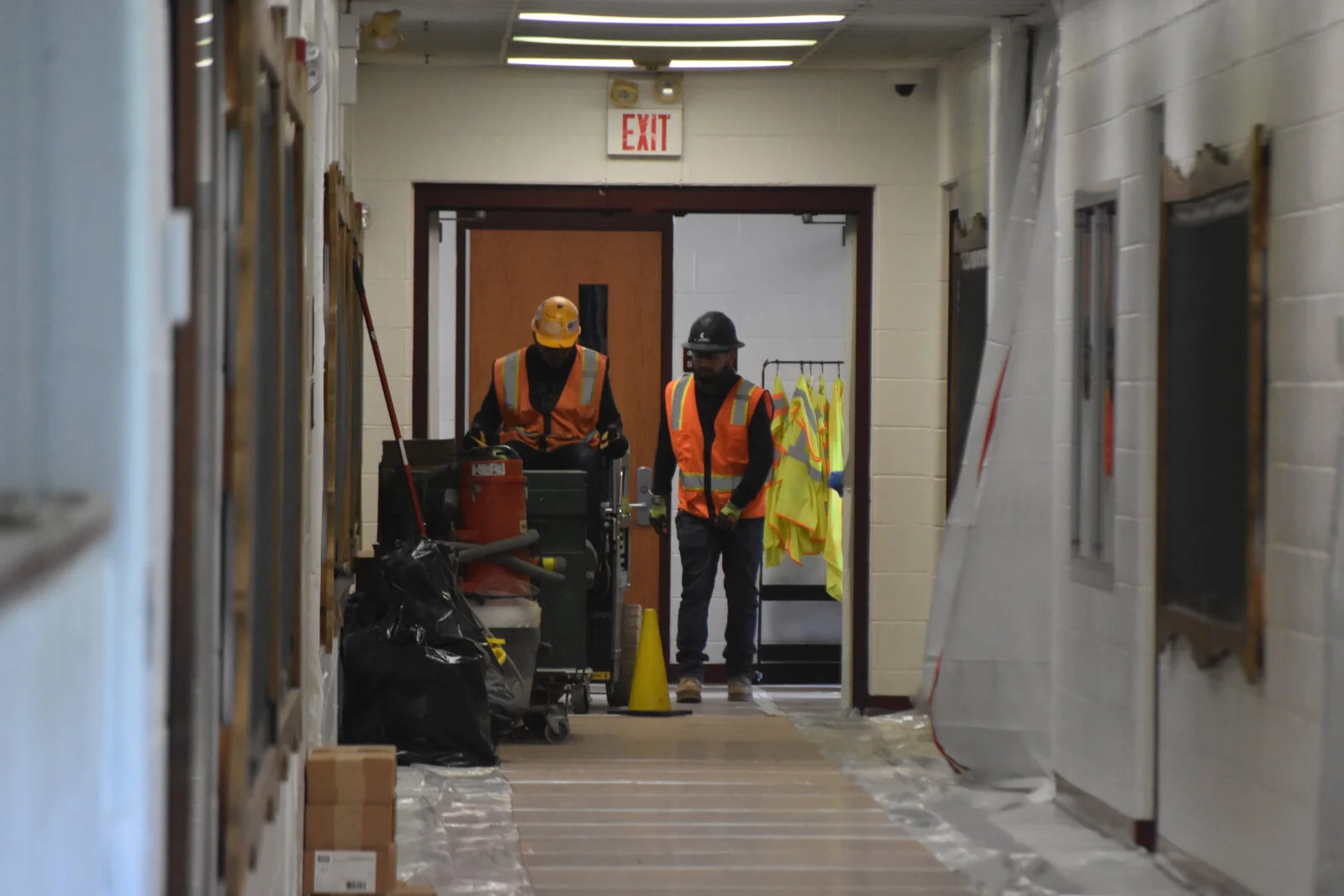Construction workers in hallway