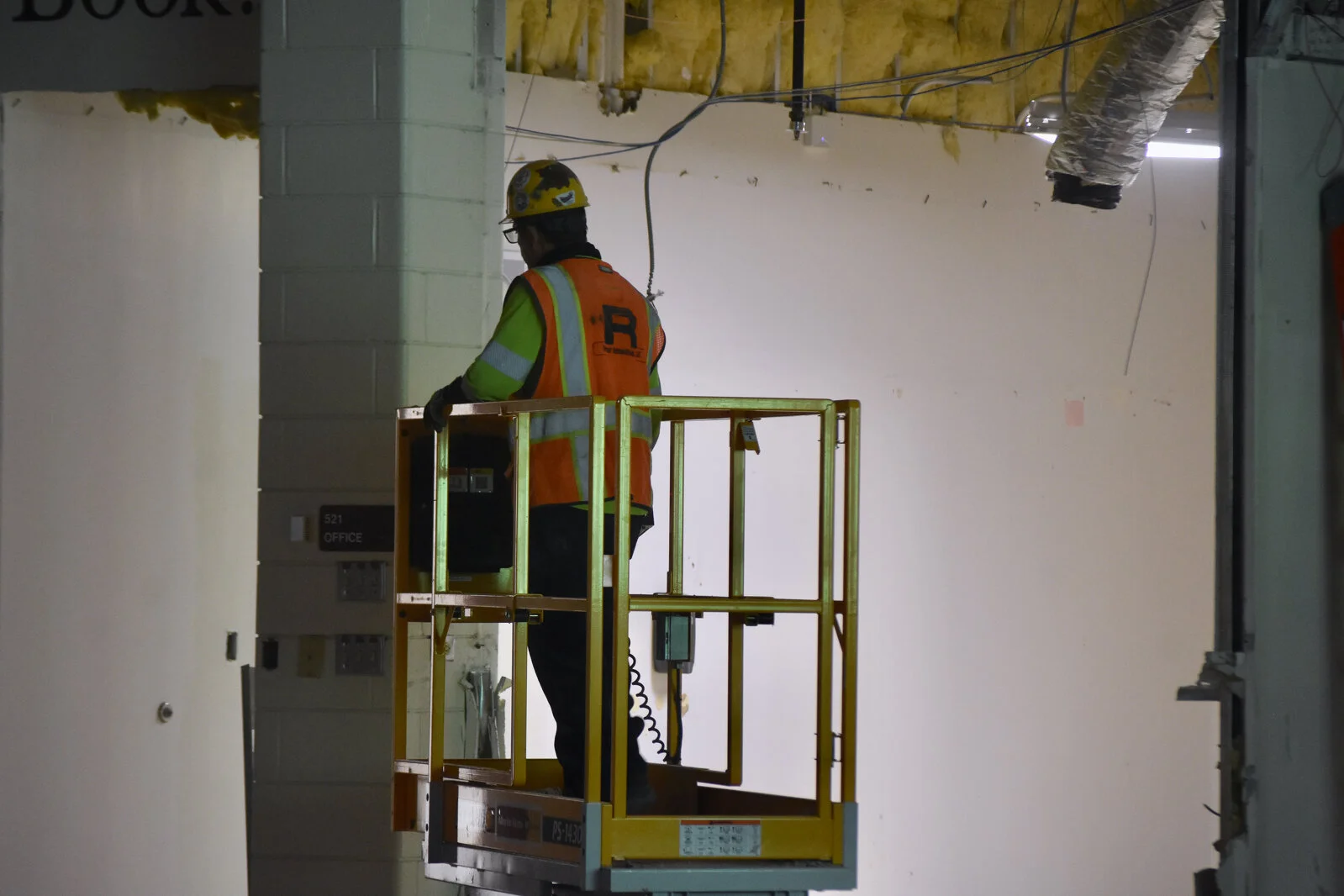 construction workers on lift