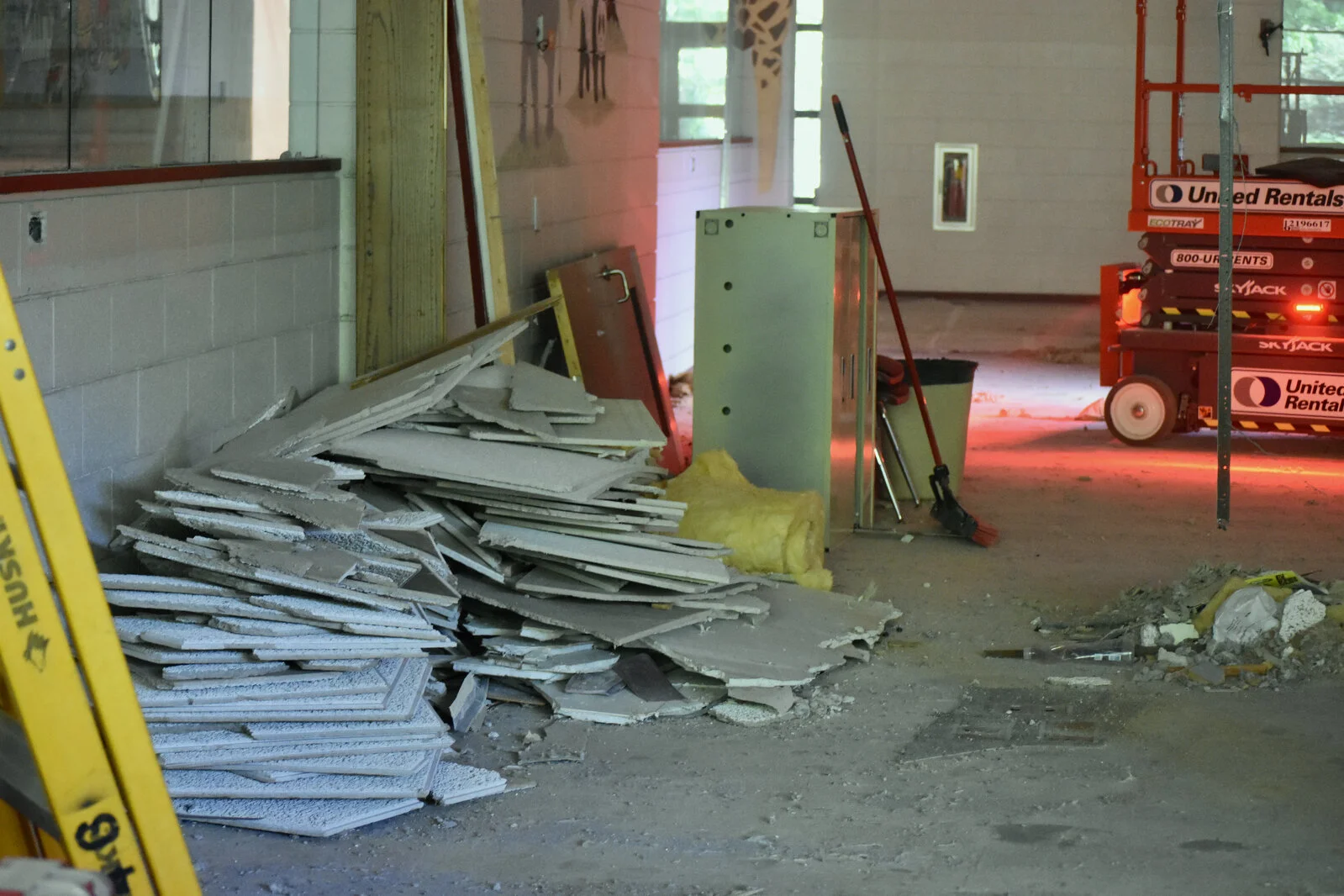 ceiling tiles piled on floor