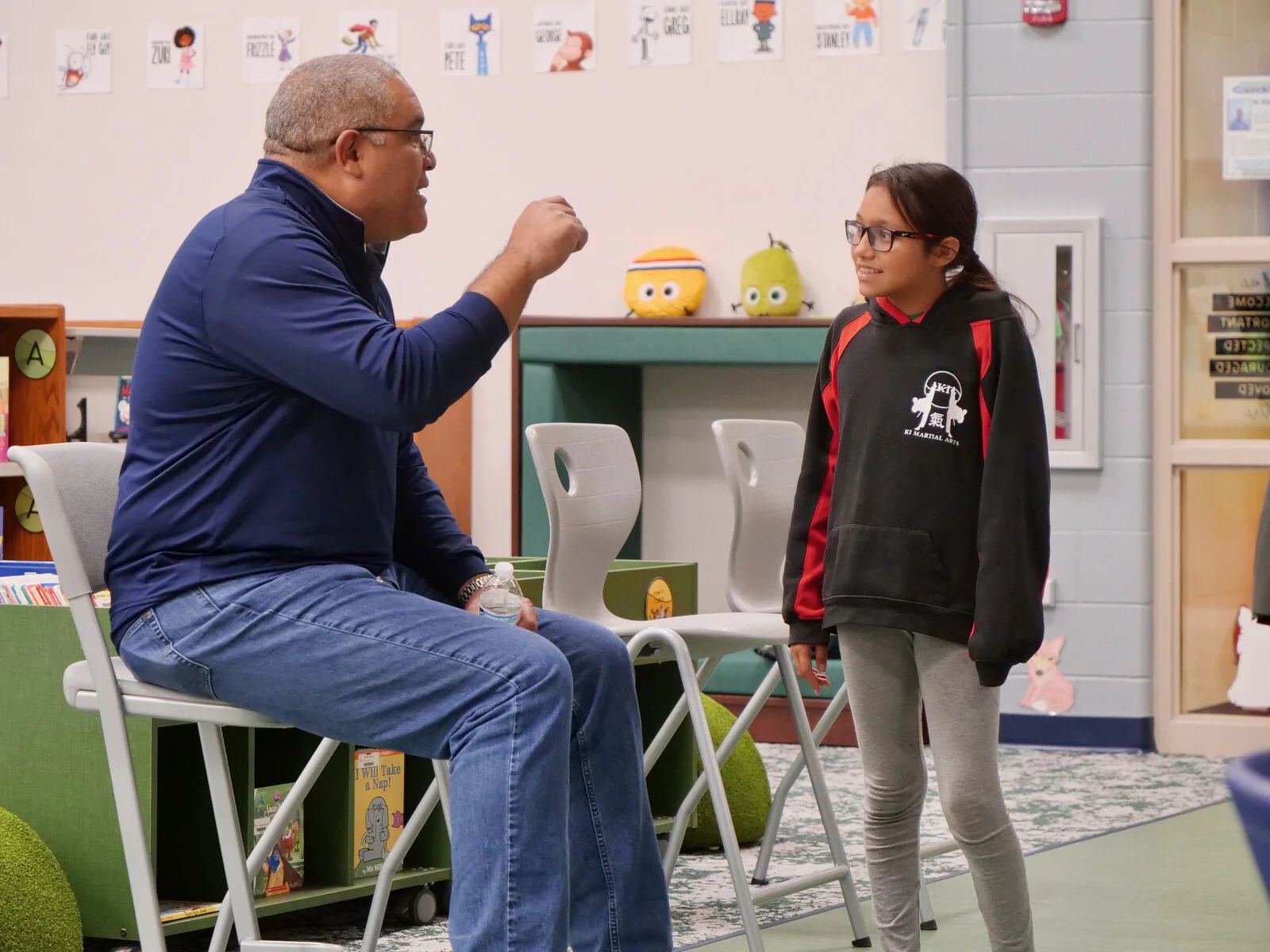 Superintendent Alfonso Carmona speaks with an Avon Center School student